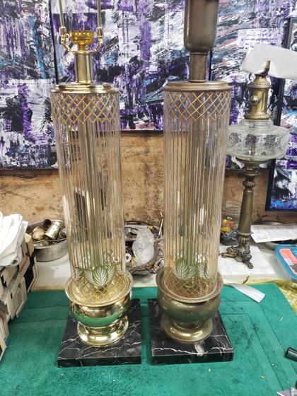 two lamps with circular glass bodies