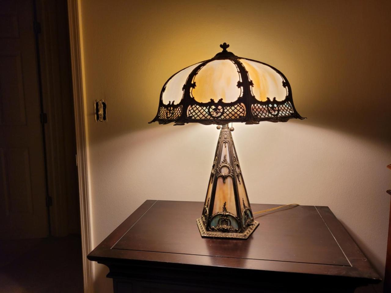 ornate table top lamp with metalwork decorations